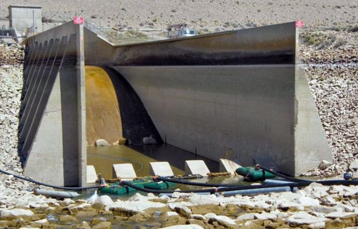 Type II stilling basin with counterforted walls. The basin has been unwatered for repairs.